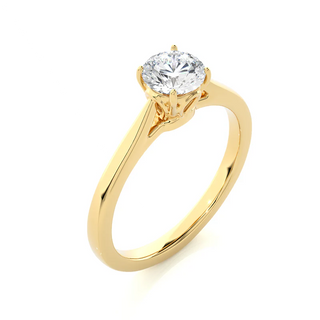 Angled view of 0.75 Carat Round Moissanite Solitaire Engagement Ring in Yellow Gold, showcasing the band and setting.