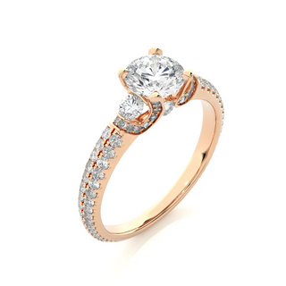 Angled view of 1 Carat Round Shaped Moissanite Engagement Ring With Accents in Rose Gold, showcasing the band and setting.