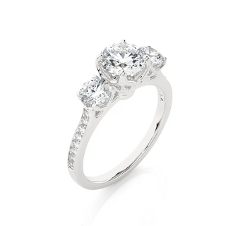 Angled view of 2.50 Carat Round Moissanite Three Stone Engagement Ring in Silver, showcasing the band and setting.