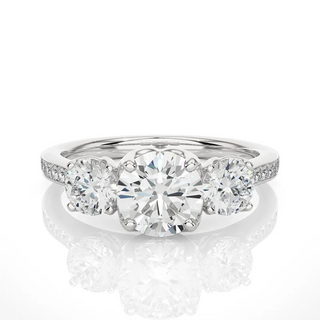 Front view of 2.50 Carat Round Moissanite Three Stone Engagement Ring In White Gold, highlighting the brilliant center moissanite stone.
