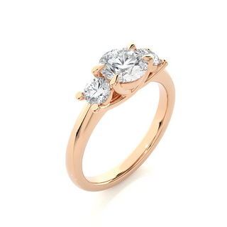 Angled view of 2 Carat Round Moissanite Three Stone Engagement Ring in Rose Gold, showcasing the band and setting.