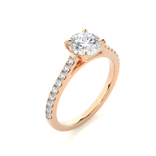 Angled view of 1.20 Ct Round Cut Moissanite Cathedral Set Engagement Ring In Rose Gold, showcasing the band and setting.