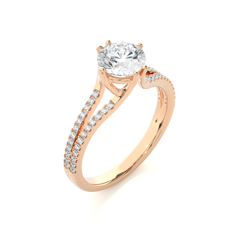 Angled view of 1.40 Ct Round Cut Moissanite Split Shank Engagement Ring In Rose Gold, showcasing the band and setting.