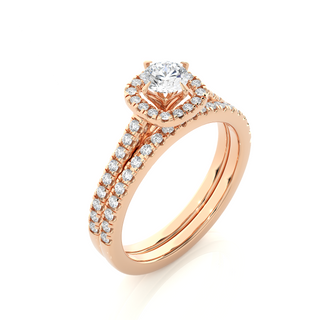 Angled view of 1.50 Carat Halo Moissanite Bridal Set With Accents in Rose Gold, showcasing the band and setting.