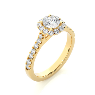 Angled view of 1.50 Carat Round Moissanite Halo Engagement Ring In Yellow Gold, showcasing the band and setting.