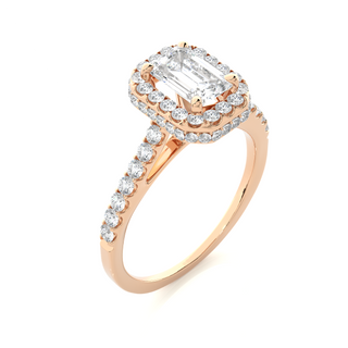 Angled view of 1.50 Ct Emerald Cut Moissanite Halo Engagement Ring In Rose Gold, showcasing the band and setting.