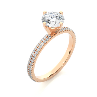Angled view of 1.50 Ct Moissanite Engagement Ring With Accents In Rose Gold, showcasing the band and setting.