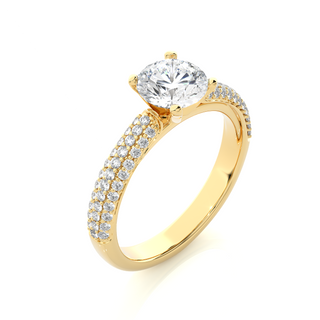 Angled view of 1.50 Ct Moissanite Engagement Ring With Three Row Accents In Yellow Gold, showcasing the band and setting.