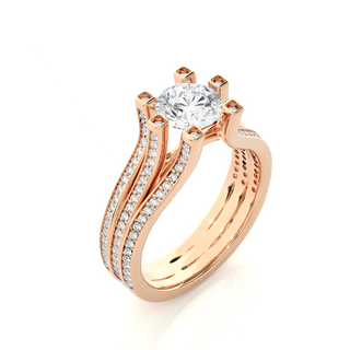 Angled view of 1.50 Ct Moissanite Three Row Split Shank Engagement Ring In Rose Gold, showcasing the band and setting.