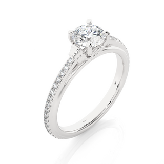 Angled view of 1.50 Ct Round Cut Moissanite French V-Split Engagement Ring In White Gold, showcasing the band and setting.