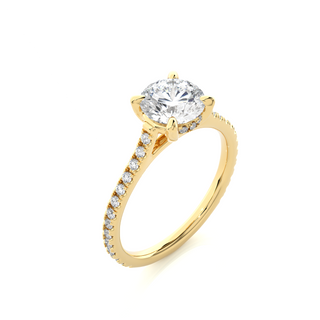 Angled view of 1.50 Ct Round Moissanite Hidden Halo Engagement Ring In Yellow Gold, showcasing the band and setting.