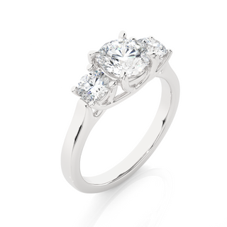 Angled view of 1.50 Ct Round Moissanite Three Stone Engagement Ring in White Gold, showcasing the band and setting.
