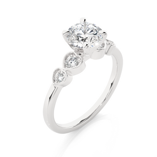 Angled view of 1.50 Ct Round cut Moissanite Five Stone Engagement Ring In White Gold, showcasing the band and setting.