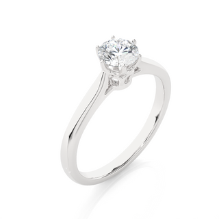 Angled view of 1 Carat Round Moissanite Solitaire Engagement Ring In White Gold, showcasing the band and setting.