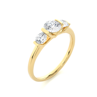 Angled view of 2 Carat Round Cut Moissanite Three Stone Engagement Ring In Yellow Gold, showcasing the band and setting.