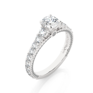 Angled view of 2 Ct Bridge Set Moissanite Engagement Ring With Accent In White Gold, showcasing the band and setting.