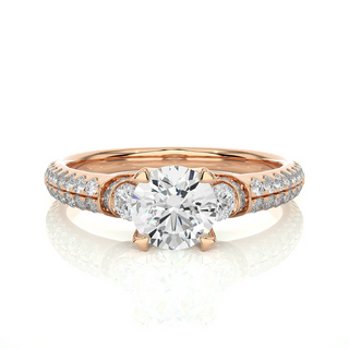 Front view of 1 Carat Round Shaped Moissanite Engagement Ring With Accents in Rose Gold, highlighting the brilliant center moissanite stone.