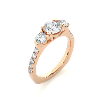 Angled view of 2 Carat Round Moissanite Engagement Three Stone Ring In Rose Gold, showcasing the band and setting.​