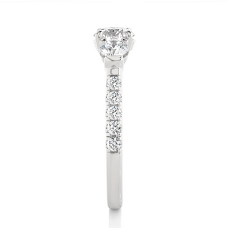 Side profile of 2 Carat Round Moissanite Engagement Three Stone Ring In White Gold, highlighting the prong setting.