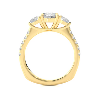 Side profile of 2 Carat Round Moissanite Engagement Three Stone Ring In Yellow Gold, highlighting the prong setting.
