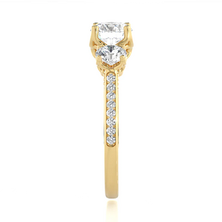 Side profile of 2 Carat Round Moissanite Filigree Three Stone Engagement Ring in Yellow Gold, highlighting the prong setting.