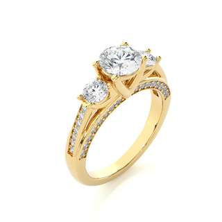 Angled view of 2 Carat Moissanite Three Stone Engagement Ring With Accents in Yellow Gold, showcasing the band and setting.​