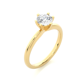 Angled view of 1.50 Carat Round Cut Moissanite Solitaire Engagement Ring In Yellow Gold, showcasing the band and setting.​