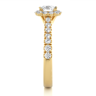 Side profile of 1.50 Carat Round Moissanite Halo Engagement Ring In Yellow Gold, highlighting the brilliant center moissanite stone., highlighting the prong setting.