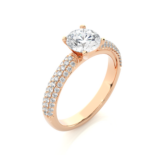Angled view of 1.50 Ct Moissanite Engagement Ring With Three Row Accents In Rose Gold, showcasing the band and setting.​
