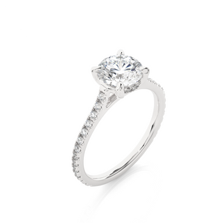 Angled view of 1.50 Ct Round Moissanite Hidden Halo Engagement Ring In White Gold, showcasing the band and setting.​