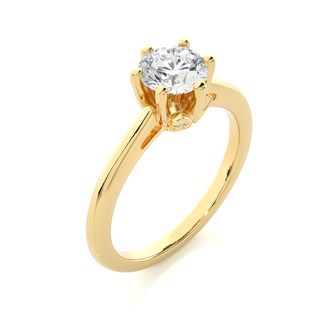 Angled view of 1.50 Ct Round Moissanite Solitaire Engagement Ring In Yellow Gold, showcasing the band and setting.​