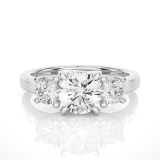 Front view of 1.50 Ct Round Moissanite Three Stone Engagement Ring in White Gold, highlighting the brilliant center Moissanite stone.