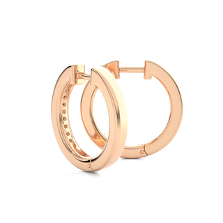 Angled view of 1 Carat Round Moissanite Channel Set Hoop Earrings In Rose Gold, showing brilliance and curved shape.