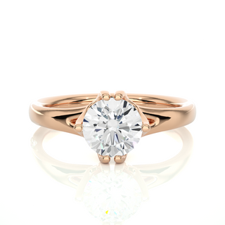 Front view of 1 Carat Round Moissanite Split Shank Solitaire Engagement Ring In Rose Gold, highlighting the brilliant center moissanite stone.
