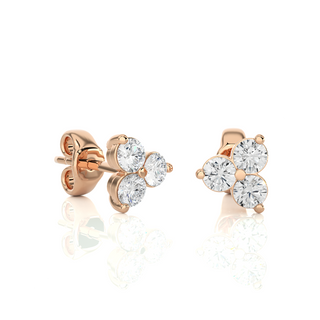 Side view of 2 Carat Round Cut Moissanite Three Stone Stud Earrings In Rose Gold, showing depth and setting details.