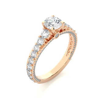 Angled view of 2 Ct Bridge Set Moissanite Engagement Ring With Accent In Rose Gold, showcasing the band and setting.​